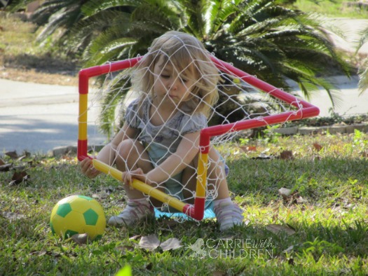 Maggie Practicing Soccer with Net