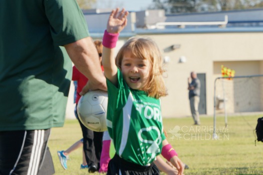 Maggie's First Soccer Game Waving Two